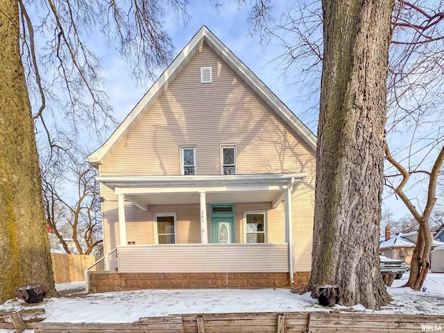 view of snow covered house