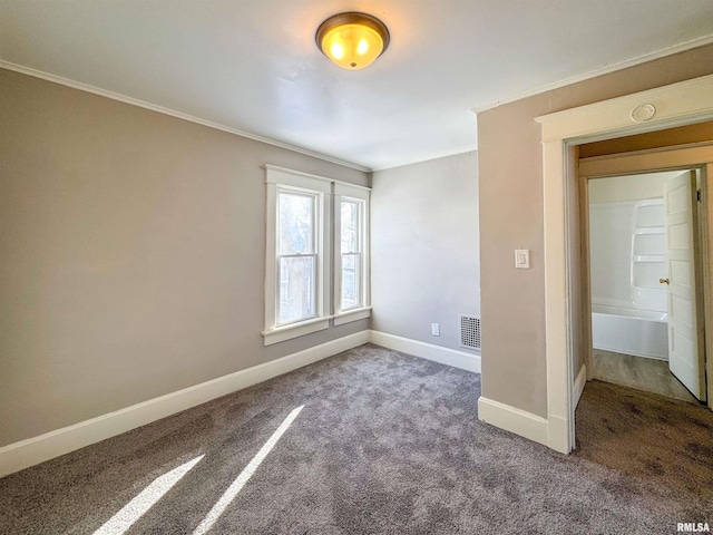 unfurnished room with carpet and ornamental molding