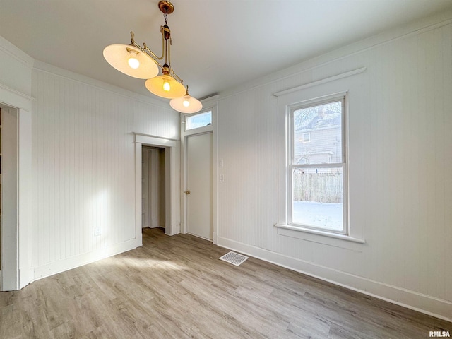 empty room with hardwood / wood-style flooring