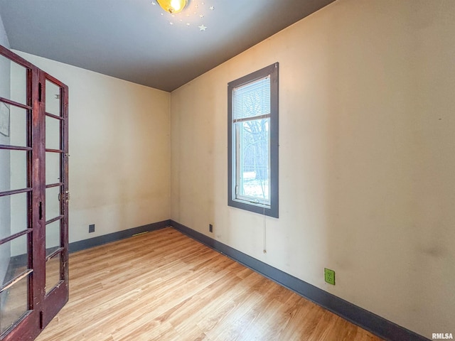 unfurnished room featuring light hardwood / wood-style floors