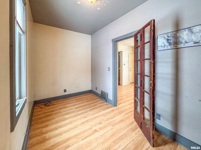 spare room with light wood-type flooring