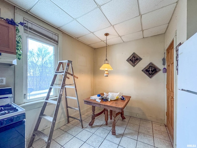 interior space featuring a drop ceiling