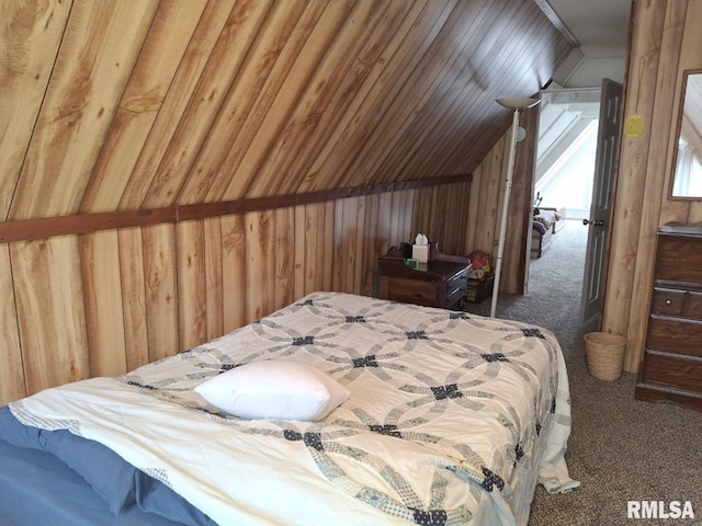 bedroom featuring wood walls, dark carpet, and lofted ceiling