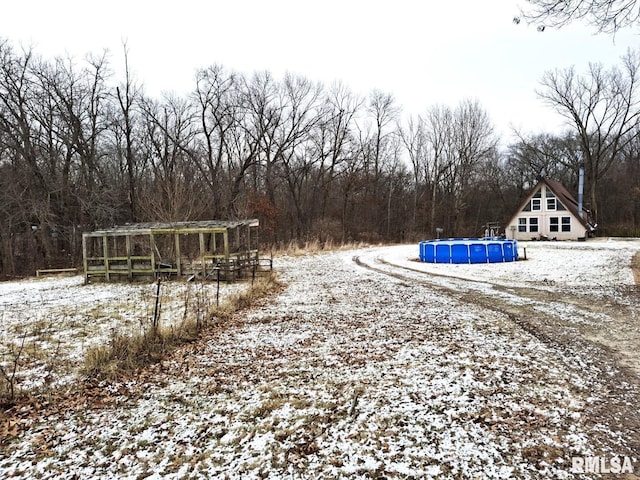 view of yard covered in snow