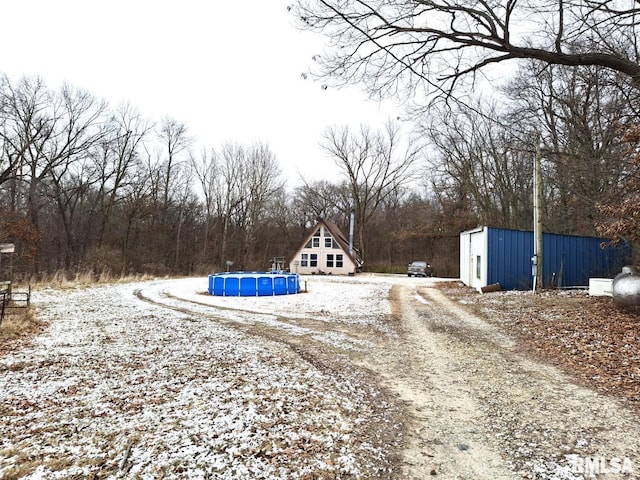 view of yard covered in snow