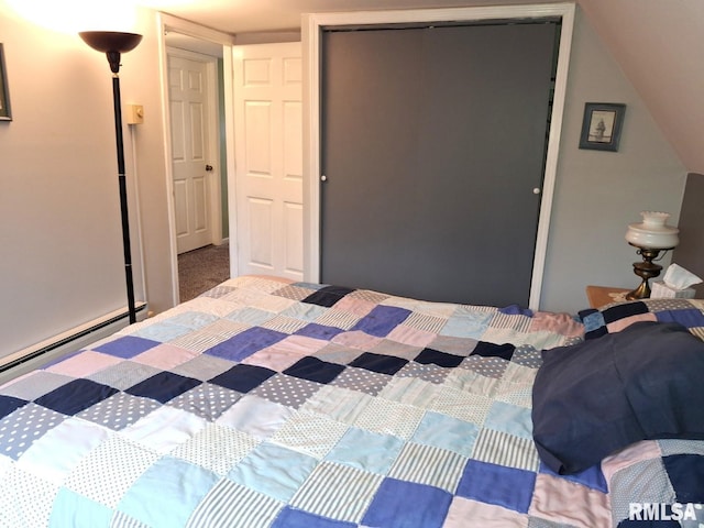 unfurnished bedroom featuring baseboard heating and a closet