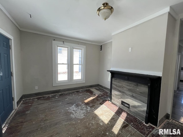 unfurnished living room with ornamental molding