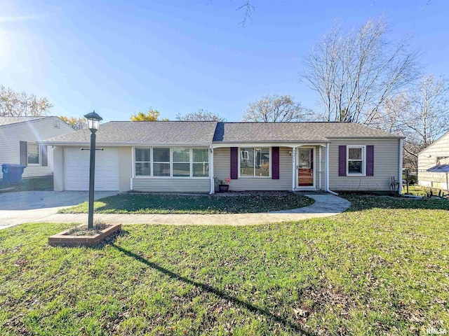 single story home featuring a garage and a front yard