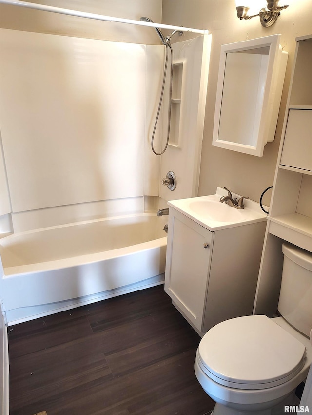 full bathroom with vanity, wood-type flooring,  shower combination, and toilet