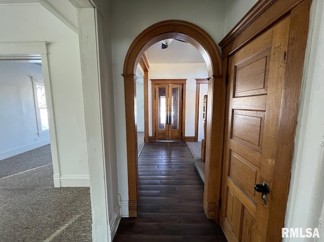 hallway with dark hardwood / wood-style floors