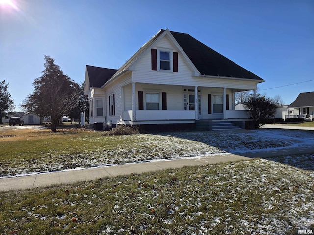 view of front of property featuring cooling unit and covered porch