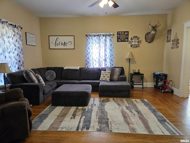 505 W Main St, La Harpe, IL 61450 - living area featuring ceiling fan and wood finished floors