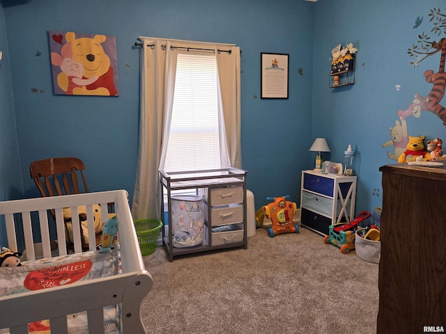 carpeted bedroom with a crib