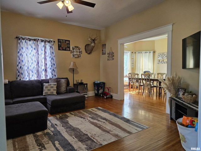 505 W Main St, La Harpe, IL 61450 - living room featuring ceiling fan and hardwood / wood-style floors