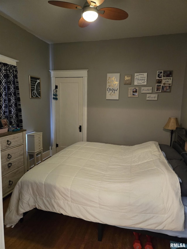 bedroom with ceiling fan and hardwood / wood-style floors