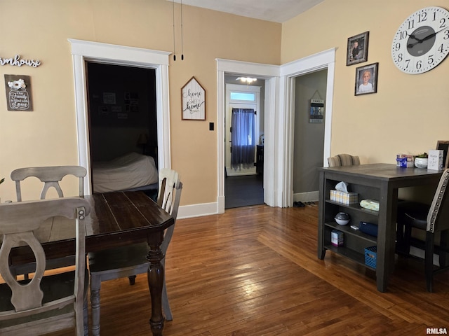 dining room with dark hardwood / wood-style floors