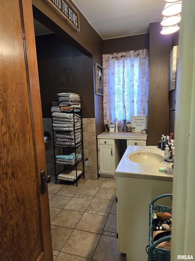 505 W Main St, La Harpe, IL 61450 - bathroom with tile patterned floors and vanity