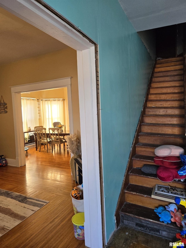 staircase featuring hardwood / wood-style floors