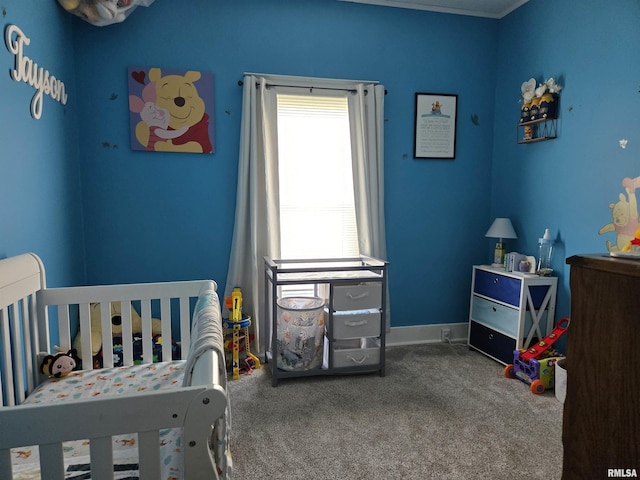 505 W Main St, La Harpe, IL 61450 - bedroom featuring carpet and a crib