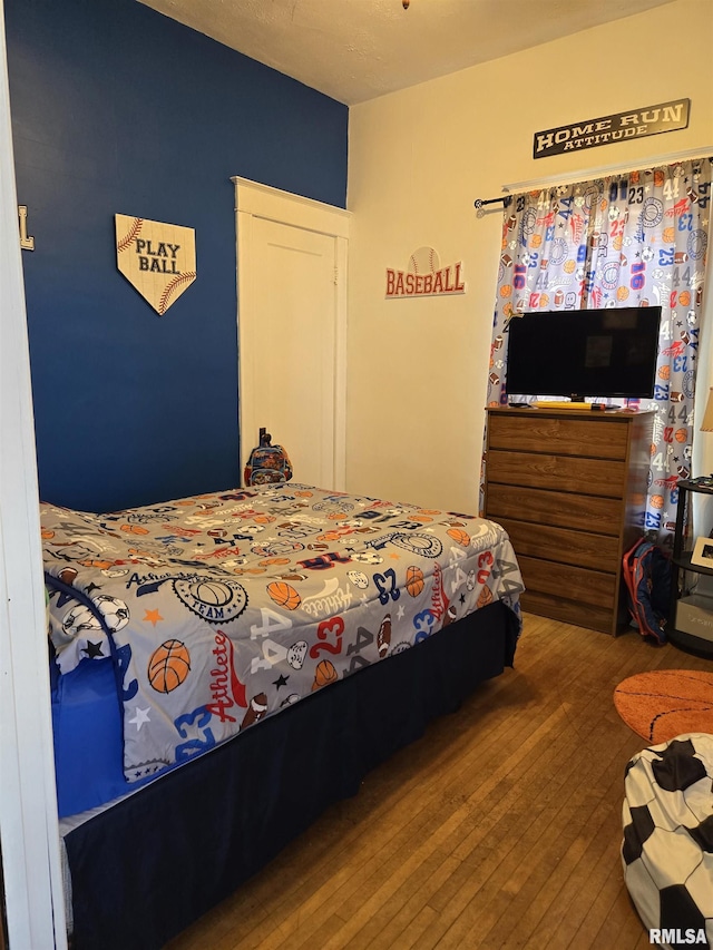505 W Main St, La Harpe, IL 61450 - bedroom with wood finished floors