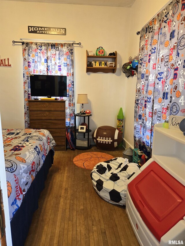 505 W Main St, La Harpe, IL 61450 - bedroom featuring wood-type flooring