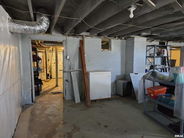 505 W Main St, La Harpe, IL 61450 - unfinished basement featuring refrigerator and washer / clothes dryer
