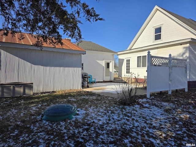 back of property featuring a fire pit