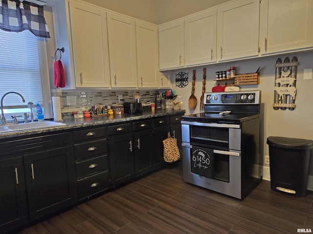 kitchen featuring backsplash, white cabinets, sink, electric range, and dark hardwood / wood-style flooring