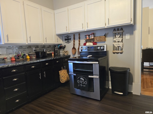 505 W Main St, La Harpe, IL 61450 - kitchen featuring double oven range, white cabinetry, and dark cabinets