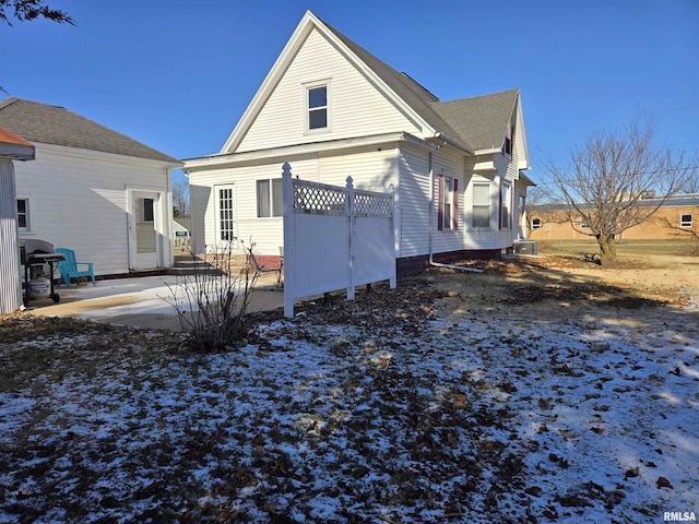 view of snow covered house