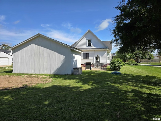 505 W Main St, La Harpe, IL 61450 - back of house with a yard and a patio
