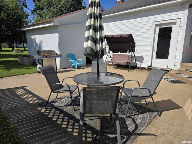 505 W Main St, La Harpe, IL 61450 - view of patio / terrace with grilling area and outdoor dining area