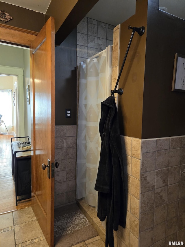 bathroom with tile walls