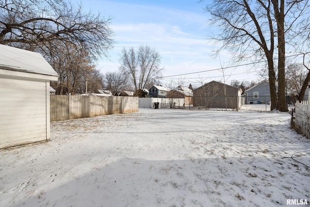 view of yard layered in snow