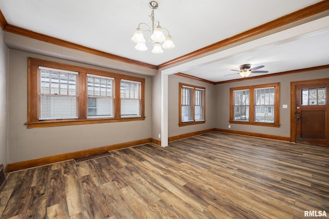 interior space with crown molding, dark hardwood / wood-style floors, and ceiling fan with notable chandelier