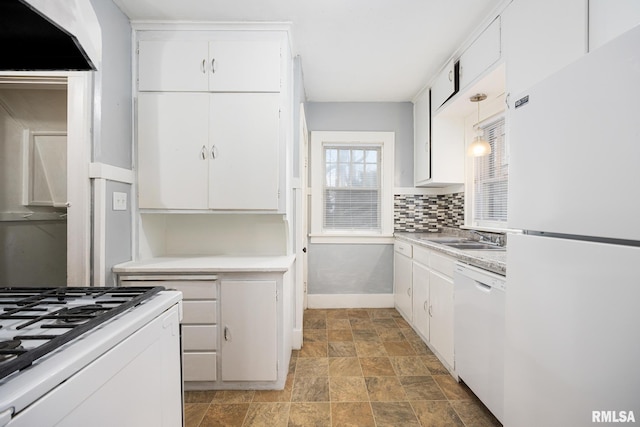 kitchen featuring backsplash, sink, white cabinets, and white appliances