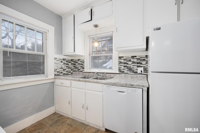 kitchen with white cabinetry, sink, tasteful backsplash, pendant lighting, and white appliances