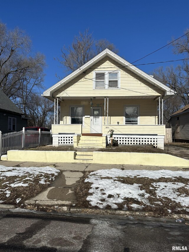 bungalow-style house with cooling unit and covered porch