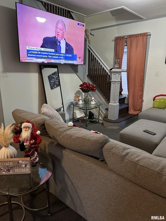 living area featuring stairs