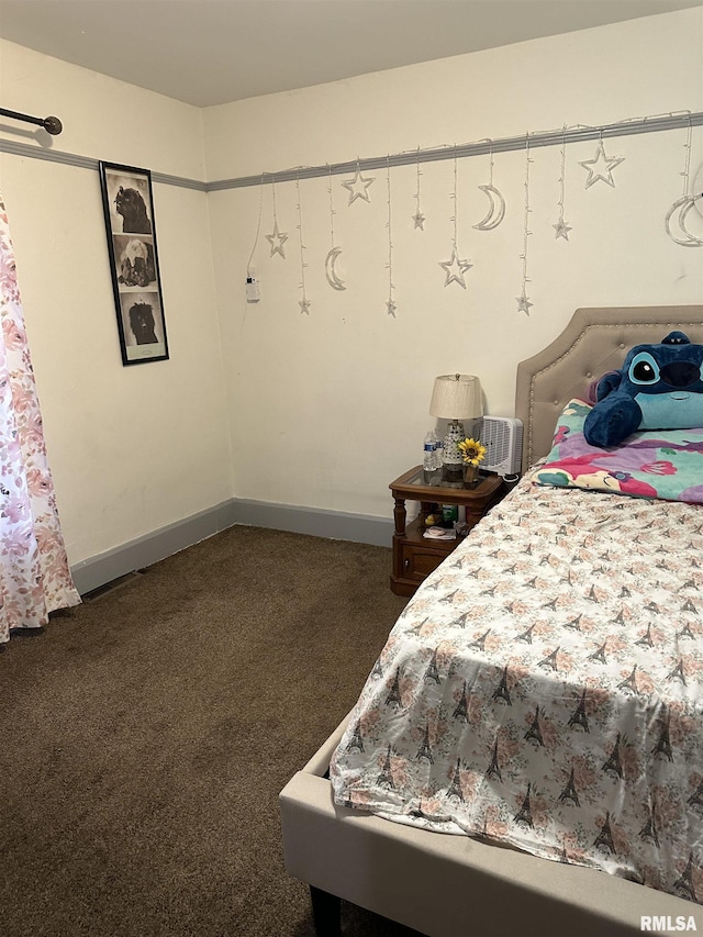 carpeted bedroom with baseboards