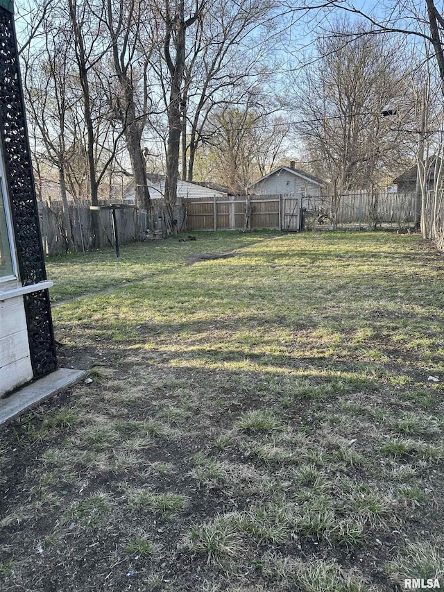 view of yard with a fenced backyard