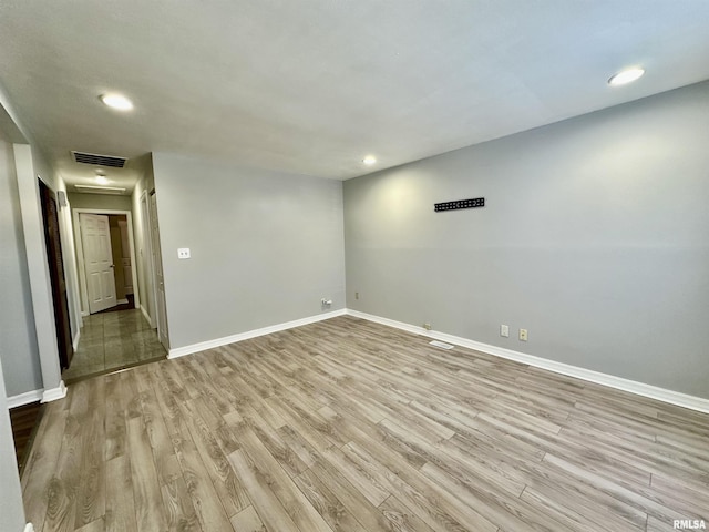 unfurnished room with light hardwood / wood-style flooring