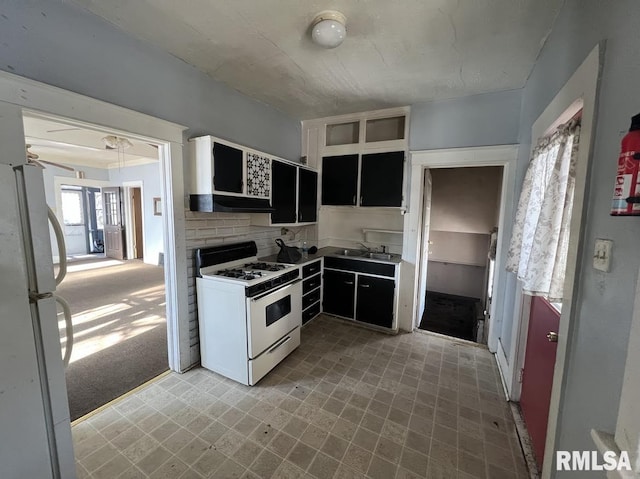 kitchen with sink, light colored carpet, exhaust hood, and white appliances