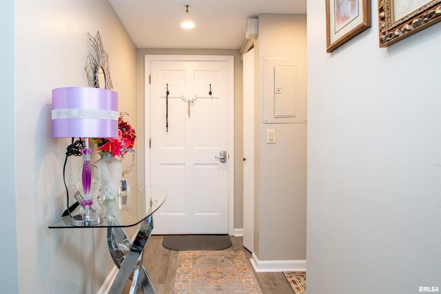 123 SW Jefferson St Unit E4W, Peoria, IL 61602 - doorway to outside featuring wood finished floors, electric panel, and recessed lighting
