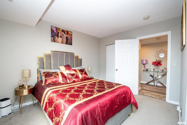 carpeted bedroom featuring a closet