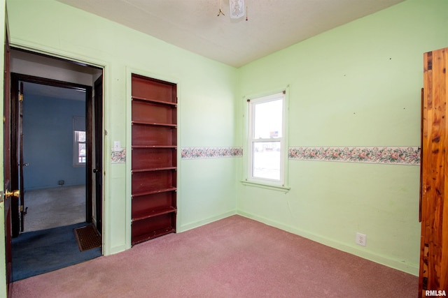 unfurnished bedroom featuring light colored carpet