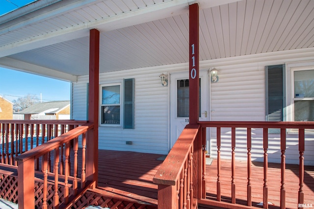 wooden terrace featuring a porch