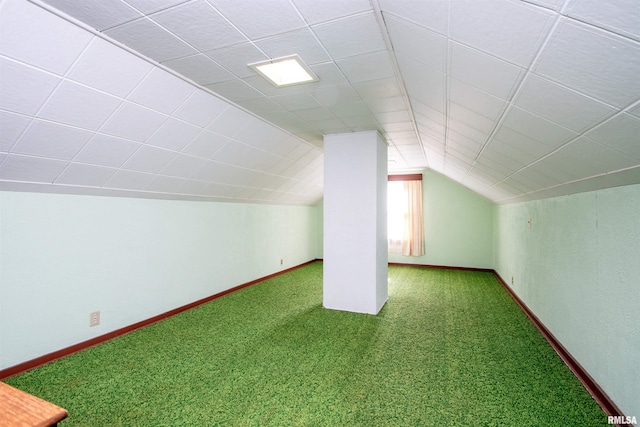 bonus room with carpet flooring and lofted ceiling