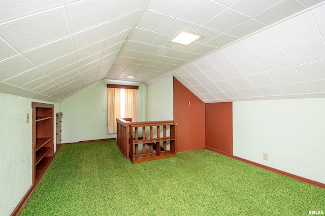 bonus room with carpet flooring and lofted ceiling