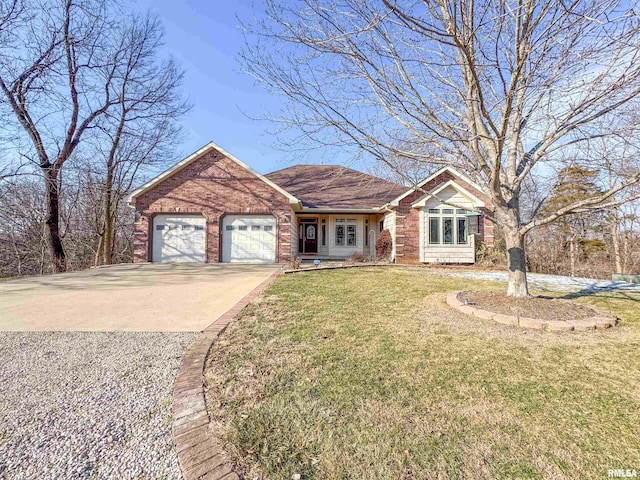 view of front of property with a front lawn and a garage